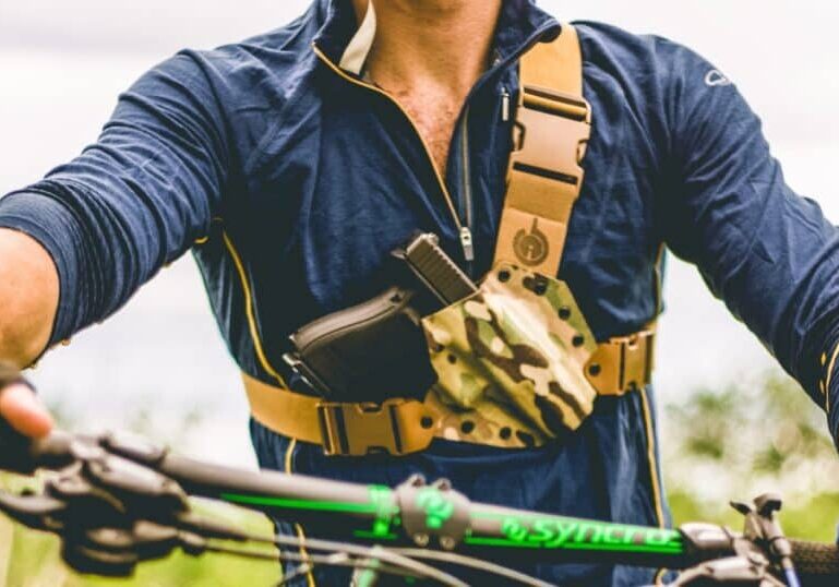 close up of a Gunfighters Inc chest holder on man on his mountain bike